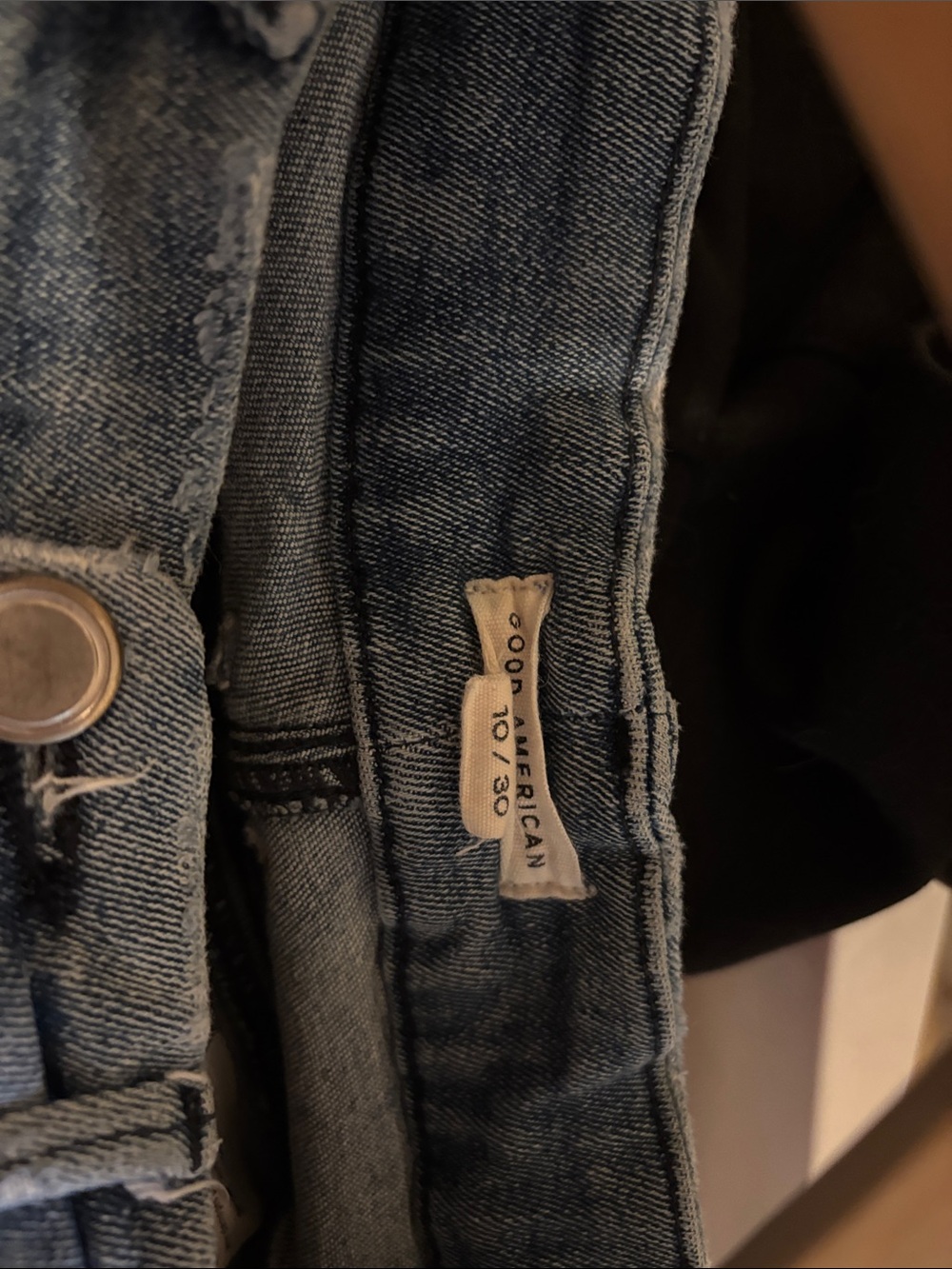 Good American Light Blue Skinny Jeans with Faded Detailing and rough edge ankle.